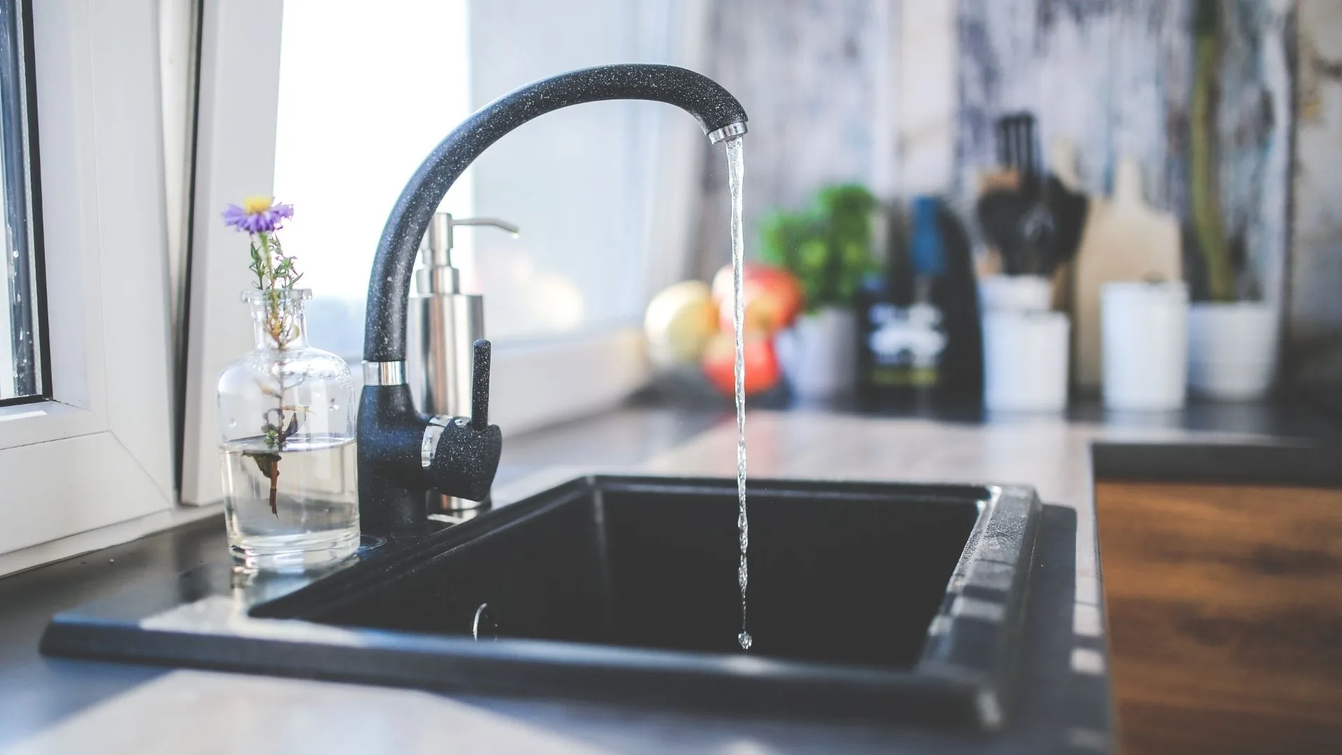 Plumber repairing sink drain in Sioux Falls
